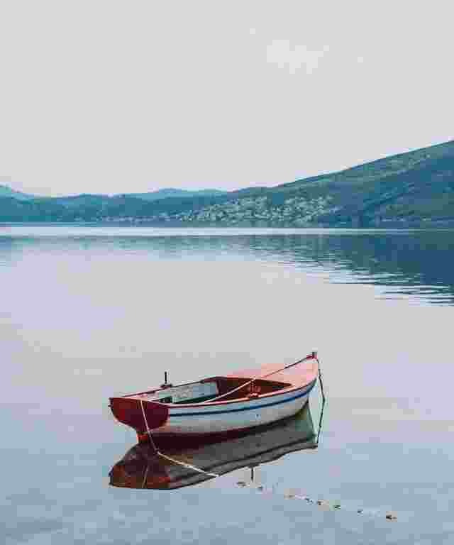 In this example, we apply the maximum 100% strength to remove artifacts from a JPG/JPEG photo of a lonely boat on a calm lake. The program smoothes the pixels of the photo as much as possible and returns an improved photo without artifacts. (Source: Pexels.)