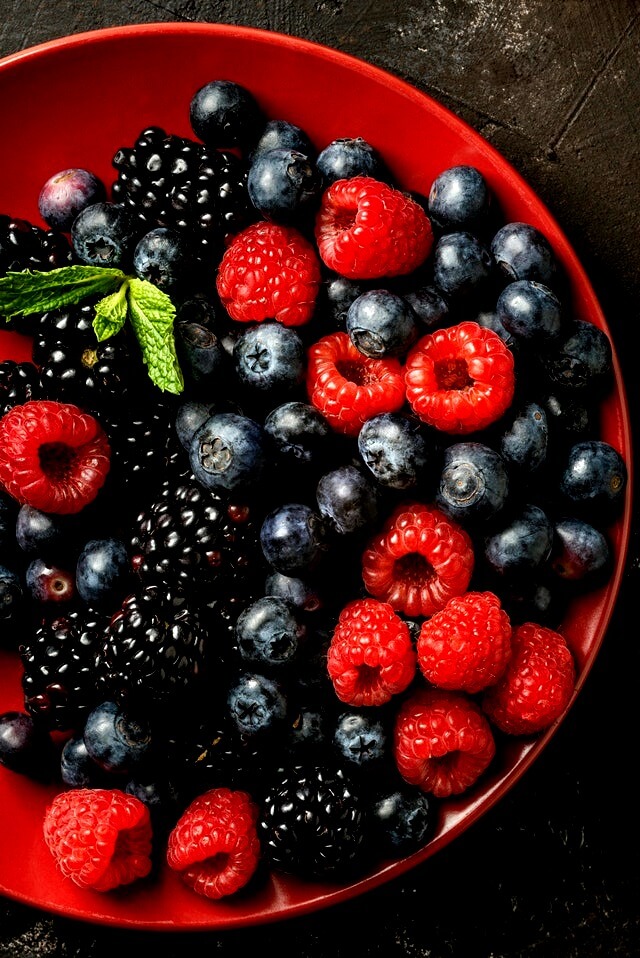 In this example, we split a JPG/JPEG image of fresh berries into two parts. In the bottom part of the image, we maintain the original contrast at 100% but in the upper part of the image, we set the contrast to be 70%, which is a 30% decrease from the bottom. (Source: Pexels.)