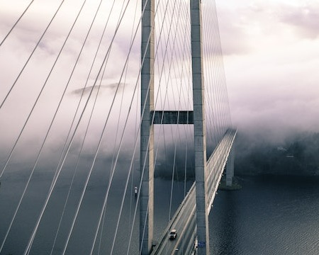 In this example, we set a custom aspect ratio "4:5" for a JPEG image of a cloudy bridge using the "Use Custom Proportions" option. We enter a value of 4 in the "width-ratio" option and a value of 5 in the "height-ratio" option. The resulting image has the proportions of 5:4 and the size of 450 by 360 pixels. Additionally, the pixels are made smooth in the output. (Source: Pexels.)