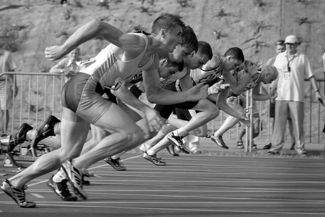 In this example, we horizontally flip an image of sprinters starting a race on a running track. In the original image, the runners are facing the left side to start running, while in the resulting image, the runners are facing towards the opposite, right side. (Source: Pexels.)